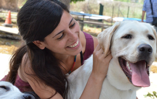 girl smiling with happy dog